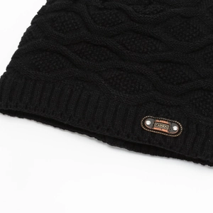 Thick black knitted beanie with a classic leather patch and warm windproof wool texture