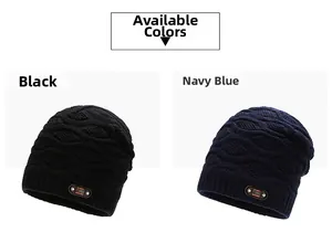 Detail view of knitted beanie with diamond texture and leather label in black and navy