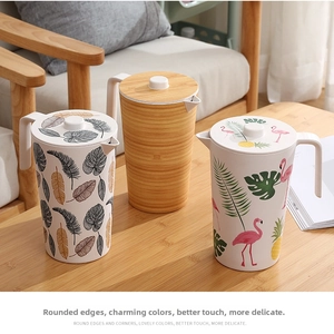Eco-friendly bamboo fiber pitchers featuring tropical leaves and wood grain patterns
