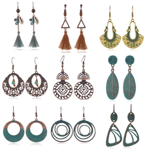 Detail view of 9 pairs of Bohemian wood and resin drop earrings in a grid layout