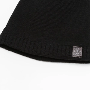 Black winter knit beanie featuring a ribbed texture and sporty star emblem patch