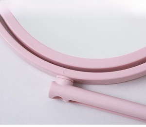 Detail of pink cat-ear vanity mirror made from smooth PP material and polished finish