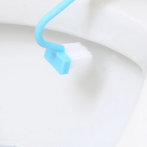 Blue V-shaped toilet brush with long handle cleaning the rim of a white toilet bowl