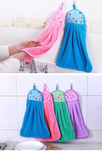 Close-up of soft coral fleece hand towels with cute fruit patterns and hanging loops