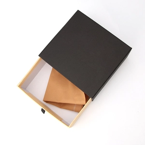 Black textured drawer gift box for belts with brown corrugated interior and soft fabric