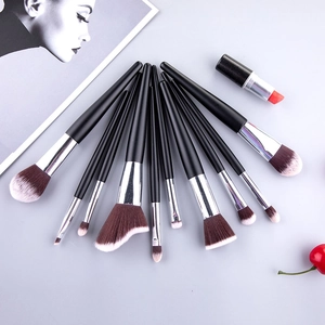 Detail of 10-piece wavy makeup brush set with silver ferrules on light gray background