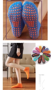 Close-up of non-slip silicone grips on cotton yoga socks and multi-color product range
