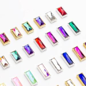 Detailed view of colorful rectangular rhinestones with gold and silver beaded metal edges