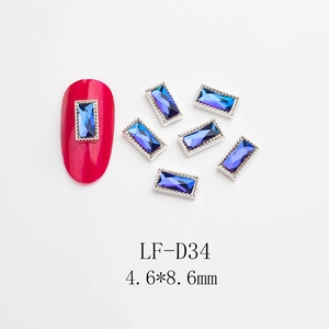 Detail of mocha blue rectangular nail crystal with silver metal border, size 4.6x8.6mm