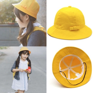Kids yellow bucket hat with adjustable chin strap and sun protection brim