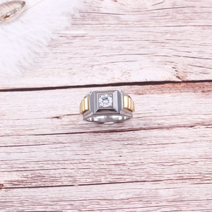 Two-tone silver and gold stainless steel men's ring featuring a round zircon center stone