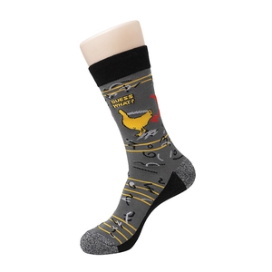 Detail of grey cotton socks featuring yellow stripes and a cartoon chick with Guess What text