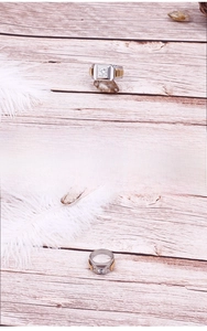 Detail showing square zircon inlay on polished steel ring with gold accents