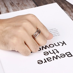 Two-tone stainless steel ring with vintage floral engraving on male hand