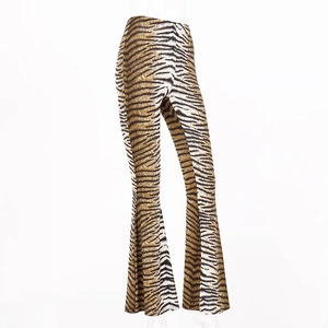 Detail of high waist leopard print flared pants showing tiger stripe pattern and fabric