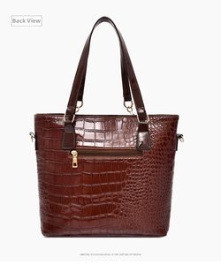 Detailed back view of brown embossed crocodile tote bag with golden zipper pocket