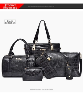 Detailed view of 6-piece black crocodile pattern faux leather handbag set with gold hardware