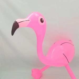 Side view of a pink inflatable flamingo toy made of durable PVC for pool and beach parties