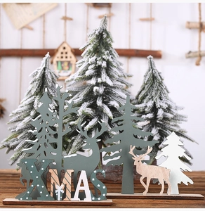 Close-up of wooden XMAS letters and reindeer figurines for Christmas tabletop decor