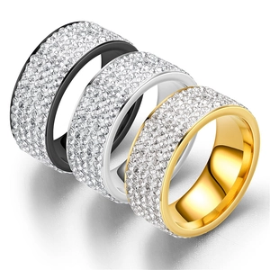 Three rows of wide band titanium steel rings in black silver and gold with full pave diamonds