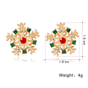 Detailed view of gold snowflake earrings with red, green, and white crystals, 1.6 cm size