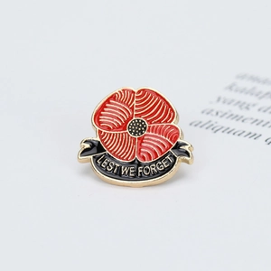 Golden poppy flower brooch with Lest We Forget ribbon for suits and lapels