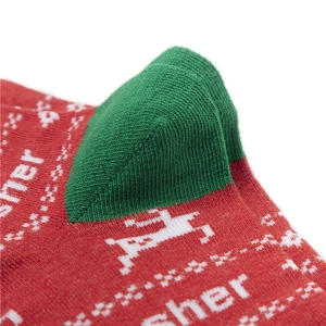 Detailed close-up of the knitted cotton reindeer pattern on red Christmas socks