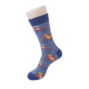 Detail of blue crew socks featuring cute cartoon fox and rabbit riding a bicycle pattern