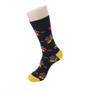 Detailed close-up of dark blue crew socks with cartoon squirrel rowing a boat pattern