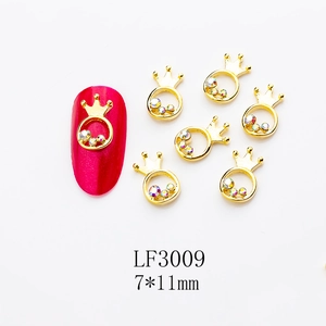 Detailed view of gold crown nail charms with rhinestones and LF3009 product sizing