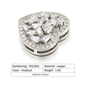 Macro view of heart jewelry connector with white cubic zirconia micro-pave setting