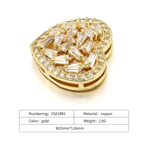 Detail of gold-plated copper heart pendant connector with sparkling zircon micro-pave