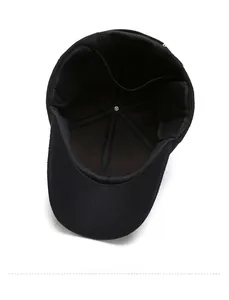 Detailed interior view of a black wool baseball cap showing warm lining and ear flaps