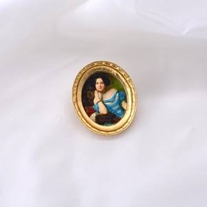 Detailed view of Baroque oval brooch with a Renaissance oil painting portrait of a lady