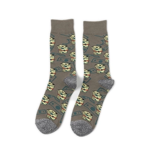 Macro shot of cotton crew socks with pixelated money prints and ribbed cuffs