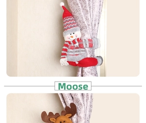 Detail of knitted Snowman and Reindeer Christmas curtain tiebacks for festive home decor