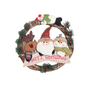 Christmas wreath with reindeer Santa and snowman plush figures on brown vine rattan ring
