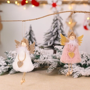 Plush Christmas angel ornaments with gold wings and heart charms on a festive tree