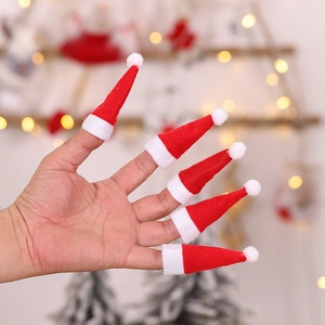 Mini red and white Christmas lollipop hats worn on fingers for festive decorations