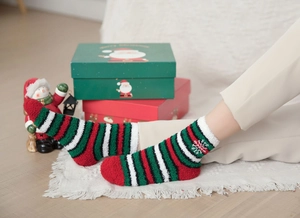 Cosy Christmas striped coral fleece socks with snowflake embroidery in a festive setting