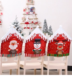 Detailed view of Christmas chair covers with Santa, snowman and reindeer festive patterns