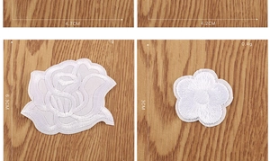Detailed macro view showing dimensions and weight of white rose and plum floral patches