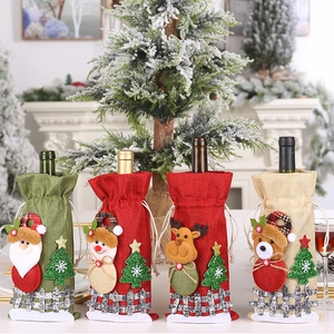 Detail of burlap Christmas wine bottle covers with 3D Santa, Snowman and Reindeer dolls