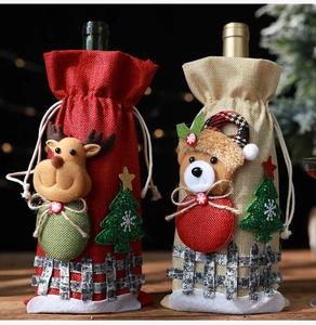 Detail of burlap wine bottle covers with 3D reindeer and bear dolls for Christmas decor