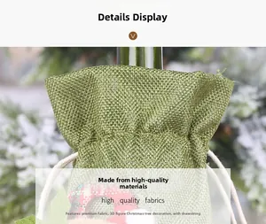 Detail of green linen Christmas wine bag showing rustic woven texture and drawstring closure