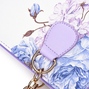 Chic shell bag with blue and purple floral patterns and gold chain handle details