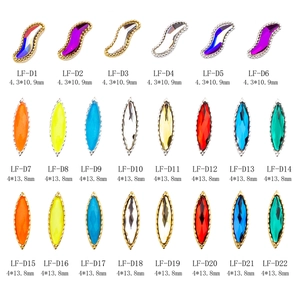 Assorted faceted nail art rhinestones with gold and silver metal trim in multiple colors