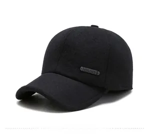 Detail of winter baseball cap showing thick fabric texture and metallic sport emblem