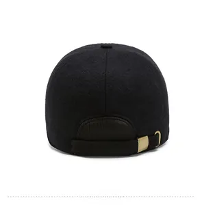 Detail view of the winter baseball cap's adjustable back strap and gold metal buckle