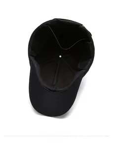 Detail of black winter baseball cap interior showing sewing lines and metal buckle